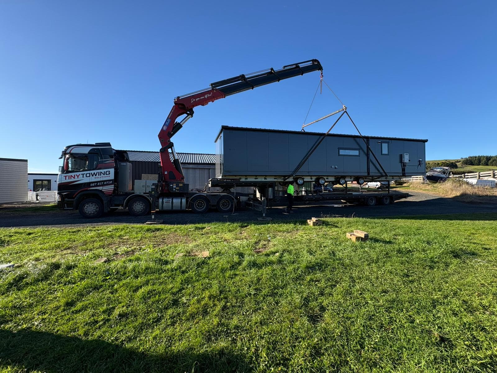 14×4 tiny home being lifted onto site by a hiab crane