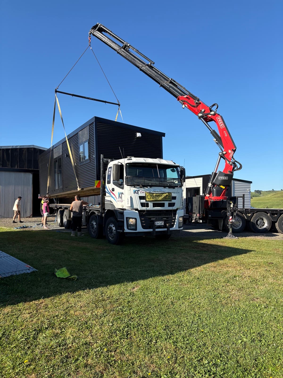 Tiny home being placed by Hiab crane