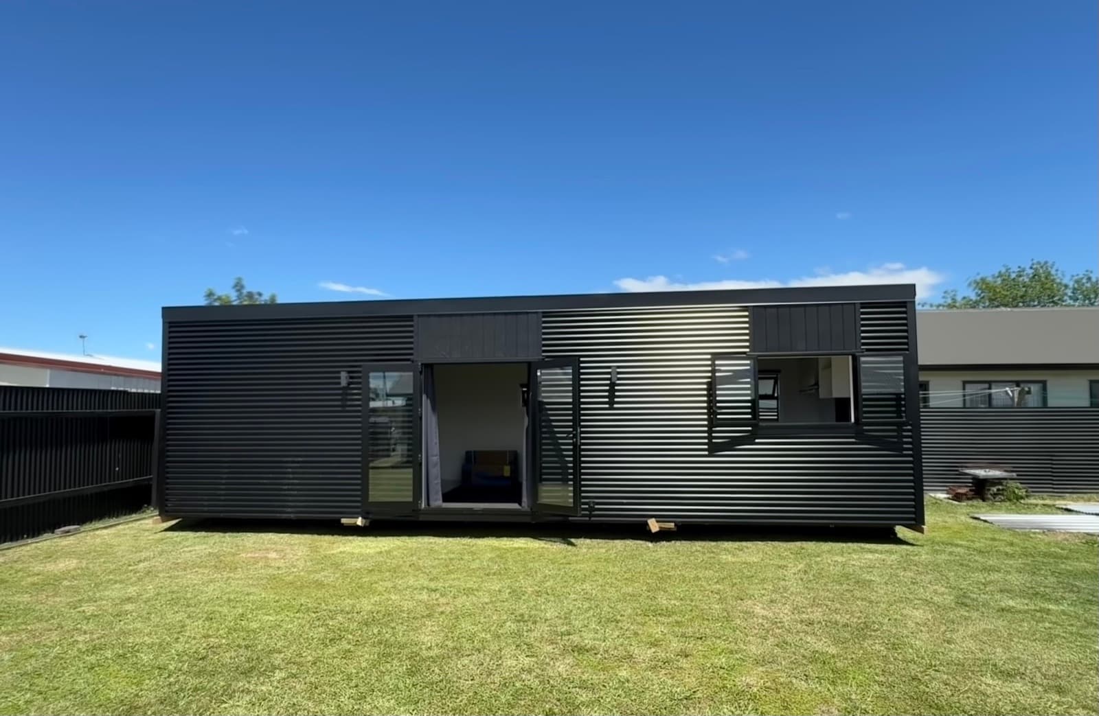Teen Retreats delivered to Auckland - Eve 10×3.5 NZ-made tiny home landed on a customer site by Hiab