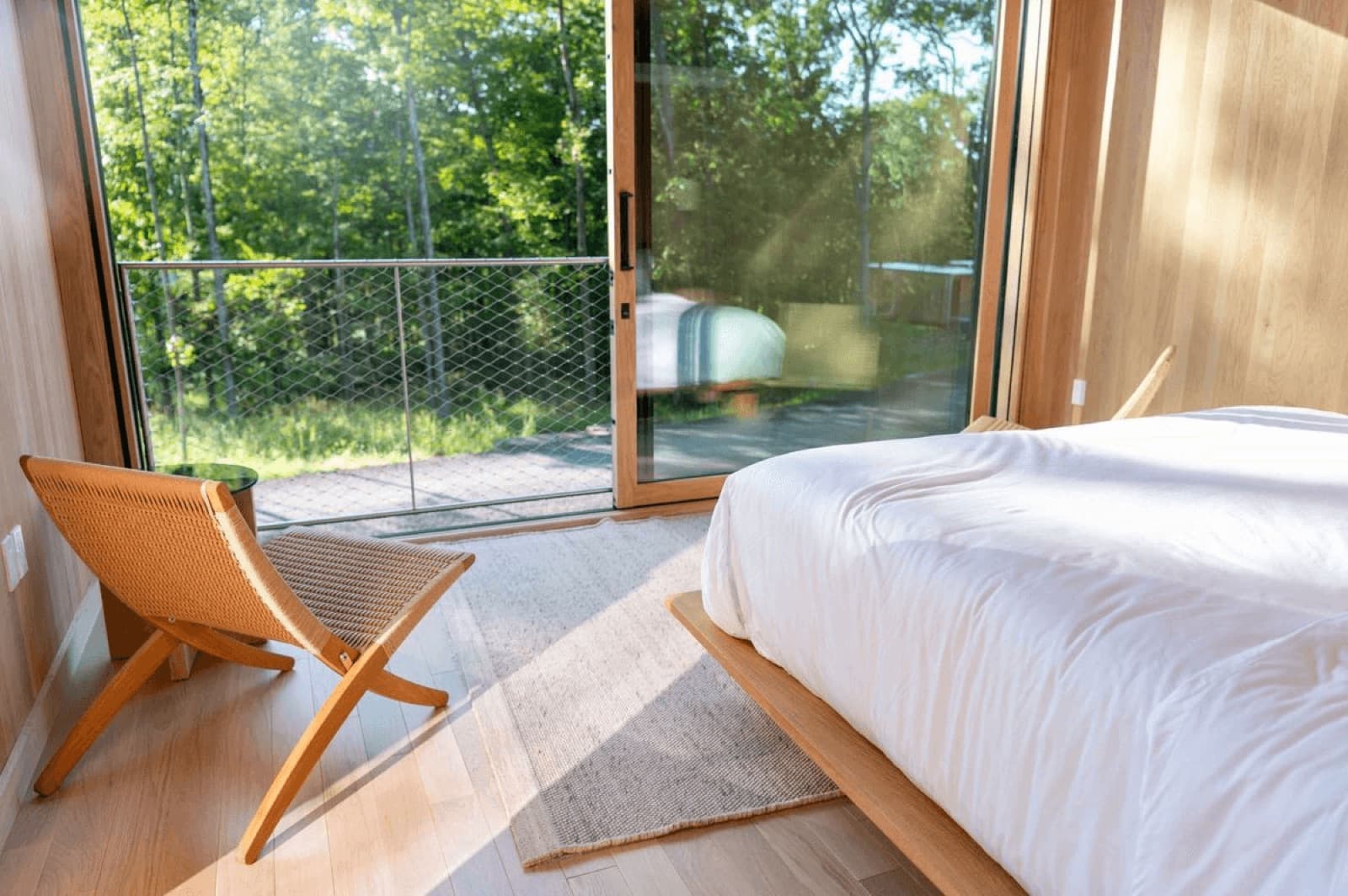 NZ-made tiny home interior with bedroom and living joinery