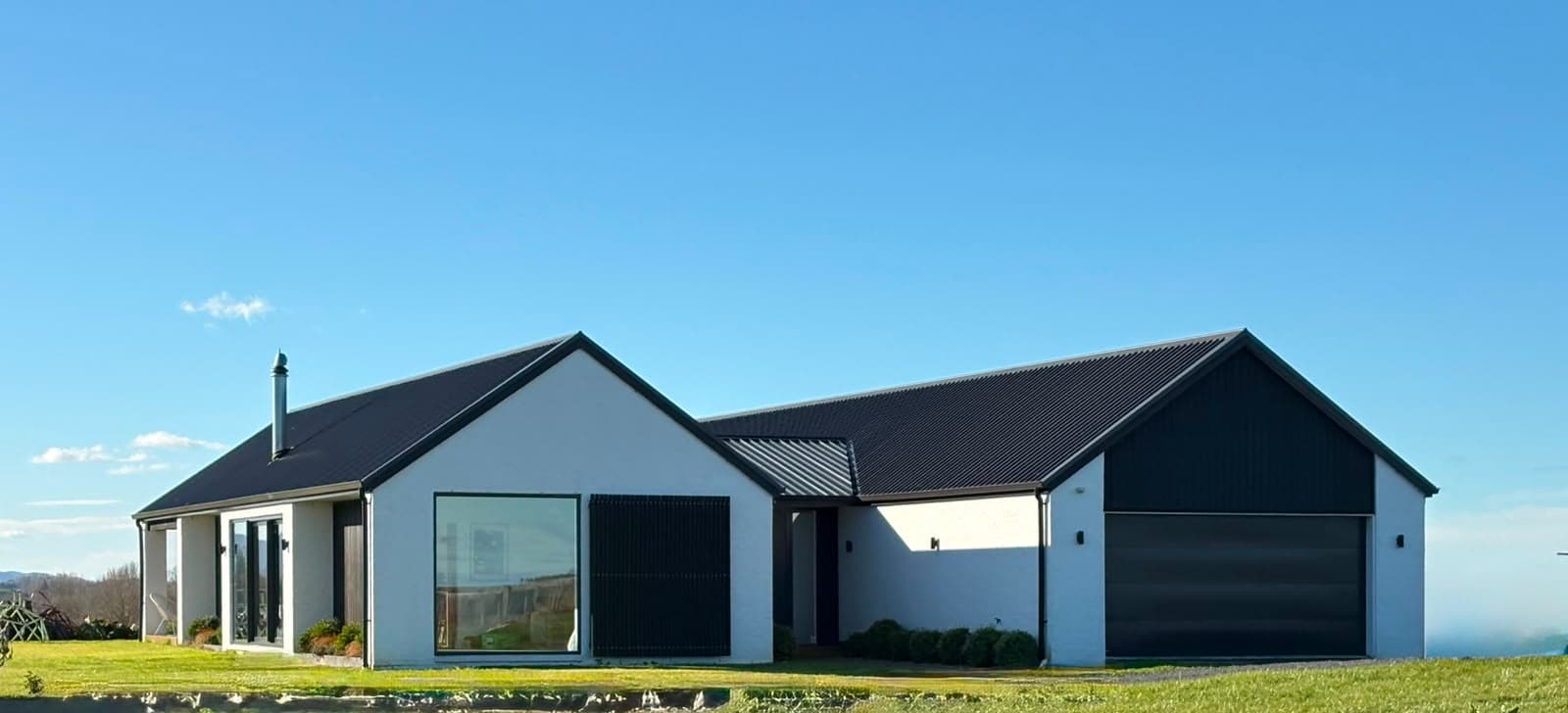 NZ-made transportable family home with white cladding and a gable roof